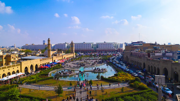 A vibrant street scene in downtown Phoenix with people enjoying a sunny day and local events.