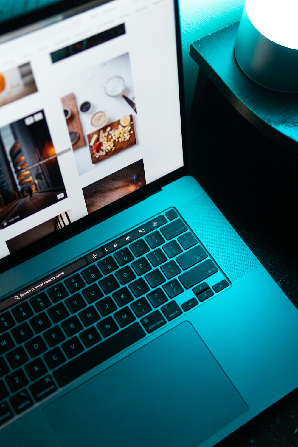 macbook pro displaying photos of man and woman