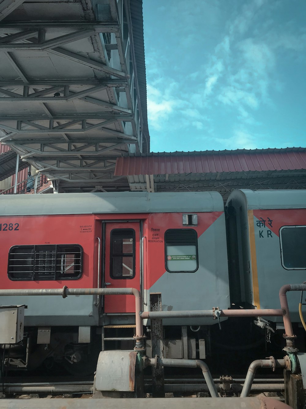 red and black train under blue sky during daytime