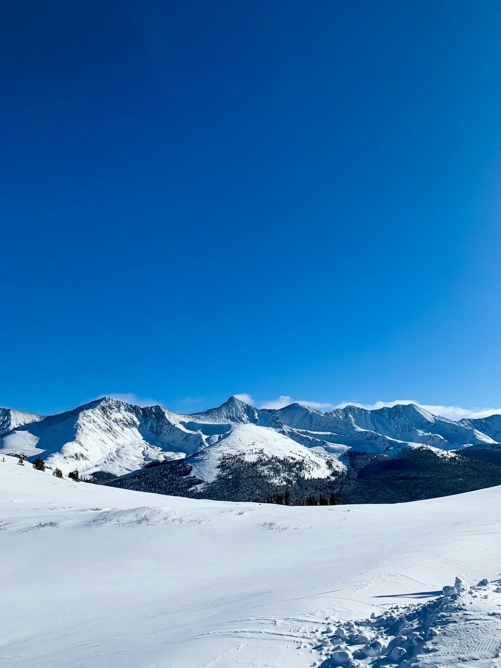 snow covered mountain under blue sky during daytime