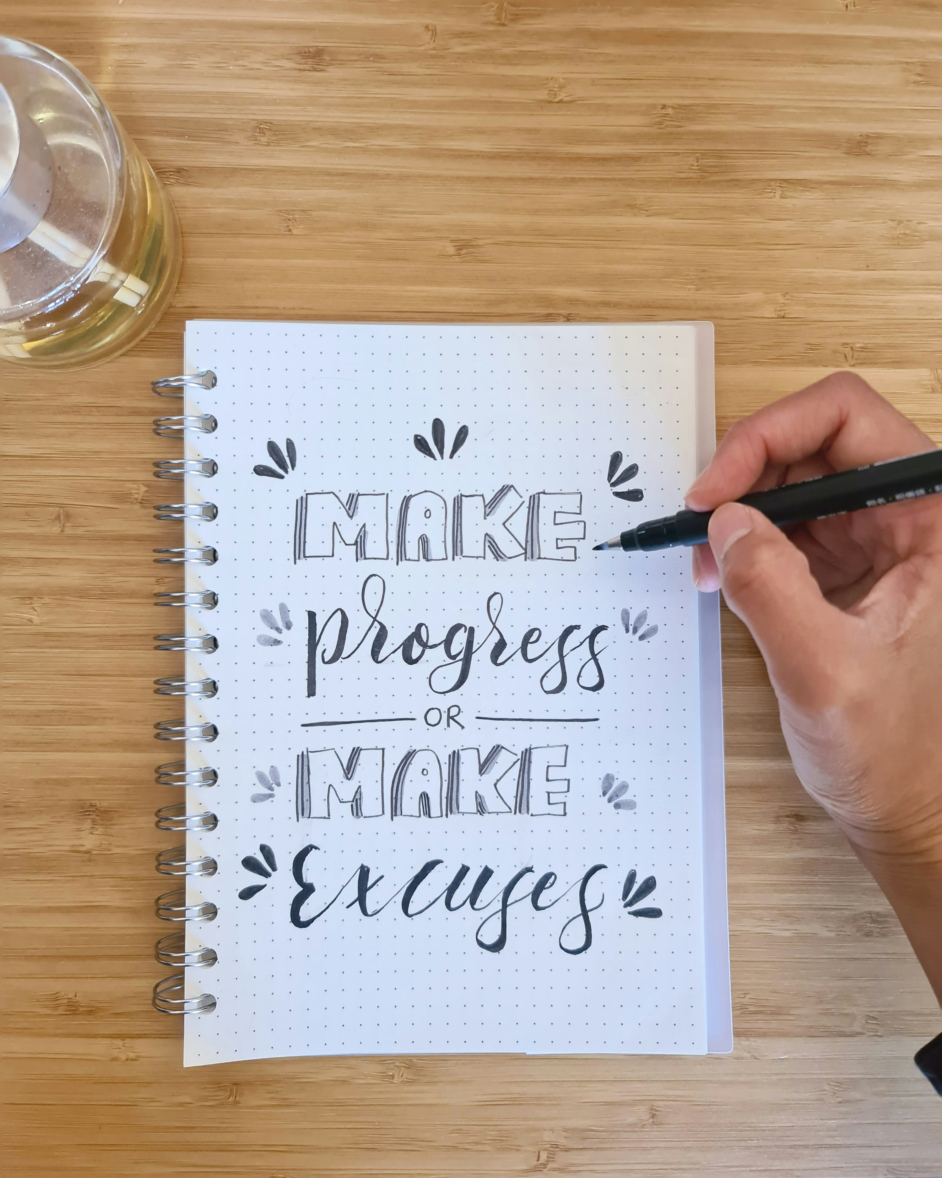 person writing on white paper