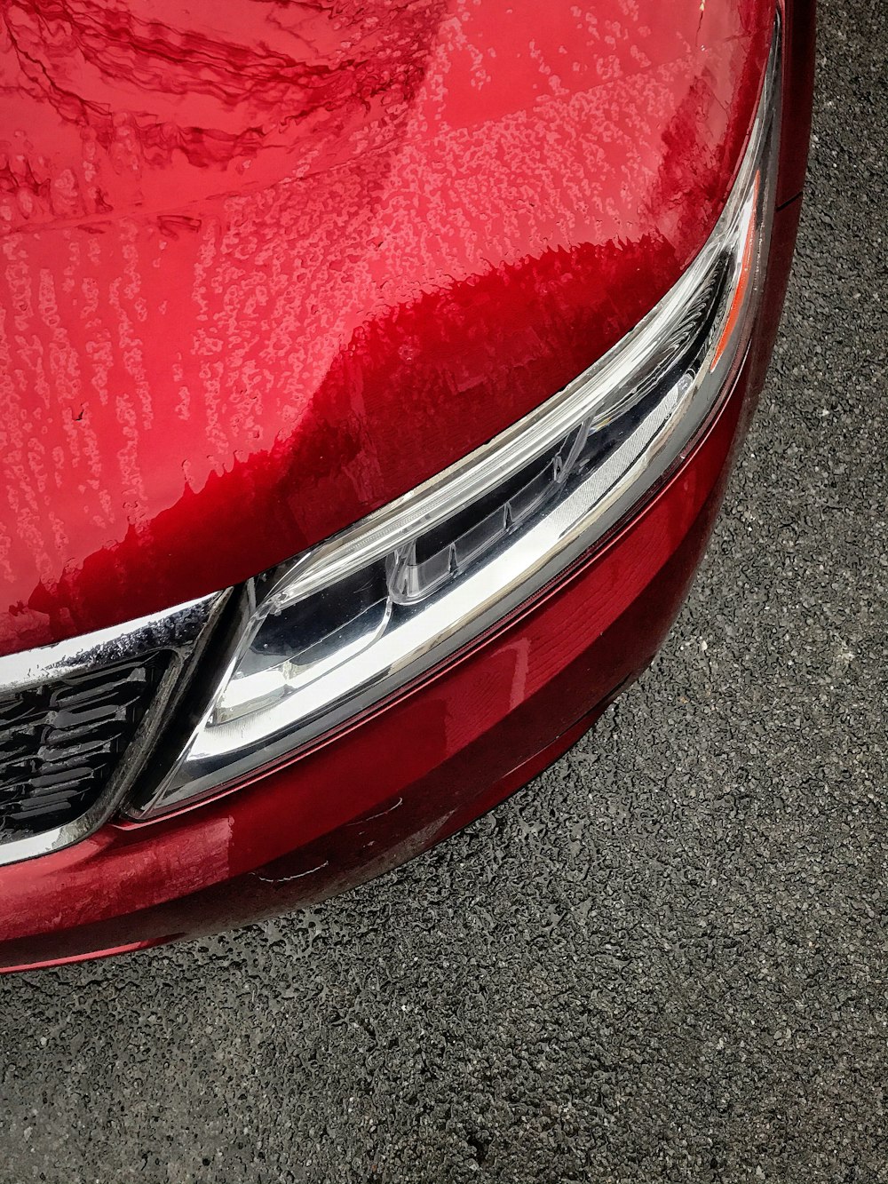 red car on gray asphalt road