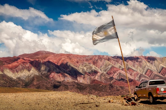 brown rocky mountain under blue sky during daytime in Jujuy Argentina