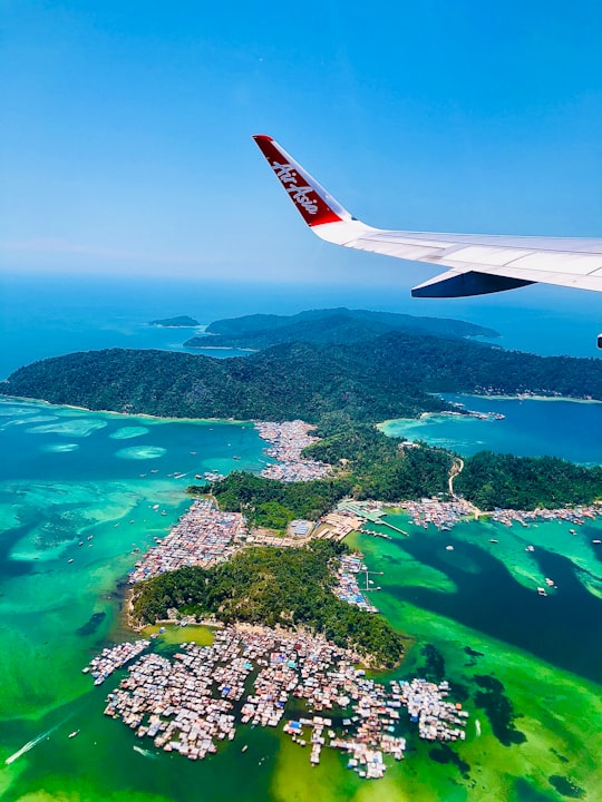 aerial view of green and white land and green trees during daytime in Kota Kinabalu International Airport Malaysia