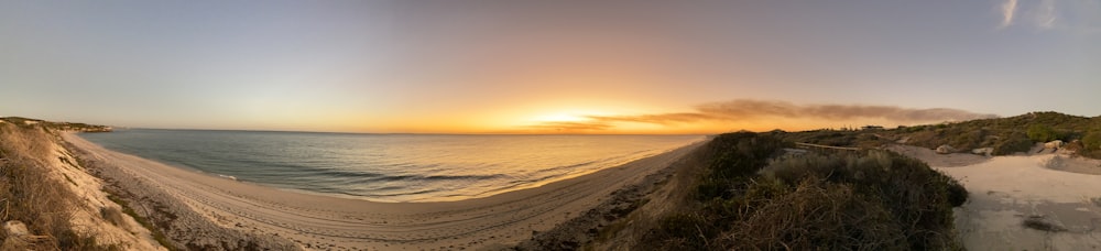 body of water during sunset