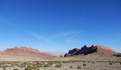 brown rocky mountain under blue sky during daytime utah zoom background