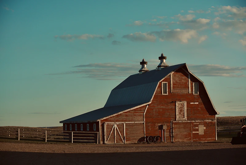 Classic red horse barn with blue sky
