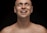 Close-up of a smiling man with a natural hairline after a hair transplant.