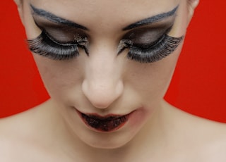 woman with black lipstick and red lipstick