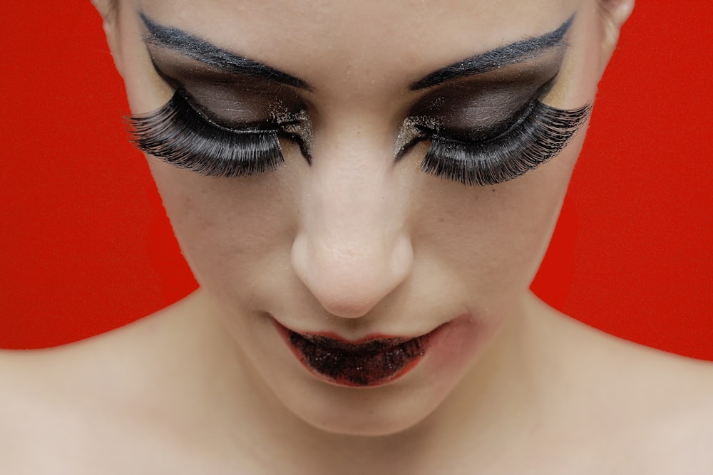 woman with black lipstick and red lipstick