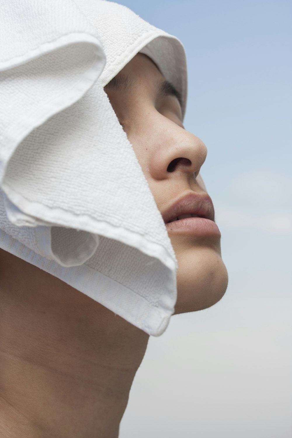 person with white textile on head