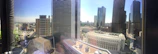 A panoramic view of a modern office skyline under a clear blue sky in Islamabad.