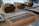 Close-up of a handcrafted wooden humidor with elegant detailing on a rustic table.