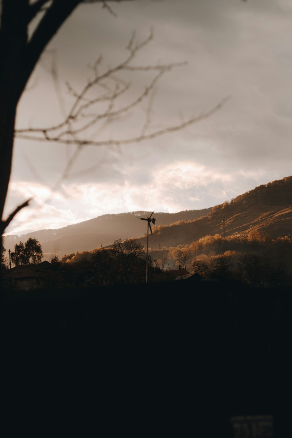 silhouette of trees and mountains during sunset