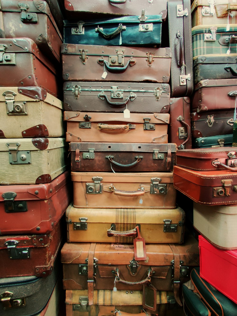 brown and red luggage bags