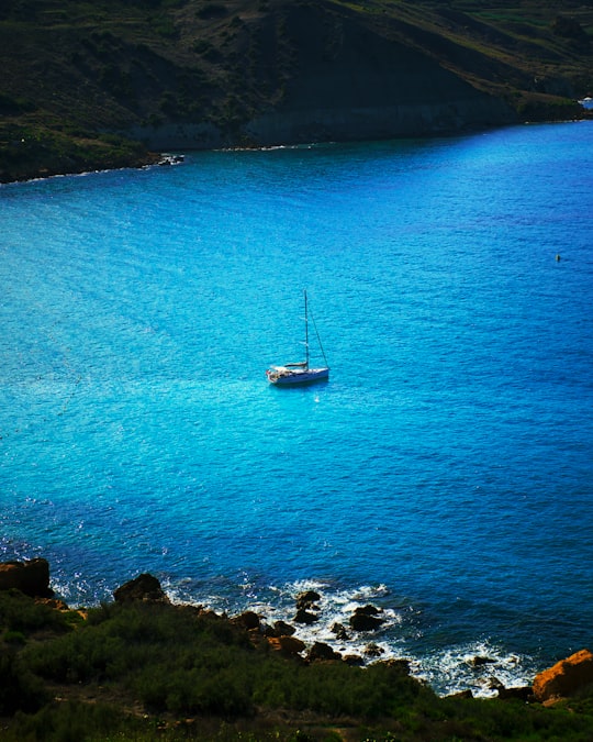 white boat on blue sea during daytime in Gozo Malta