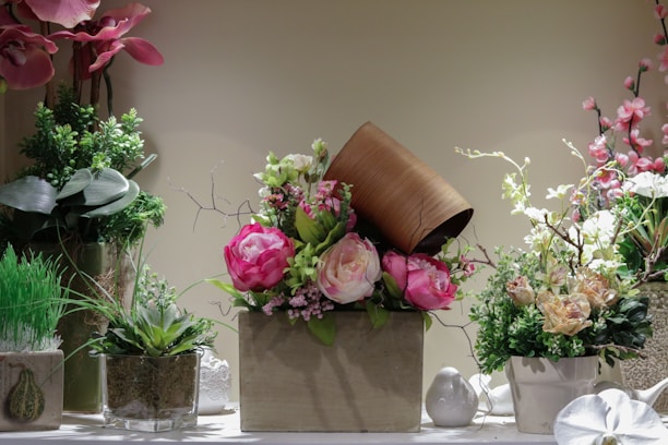 An elegant arrangement of artificial flower pots for home decoration.