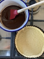 Step-by-step shots showing the process of melting and tempering chocolate in a cozy kitchen
