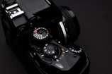 Close-up of a high-end mirrorless camera highlighting its intricate buttons and dials.