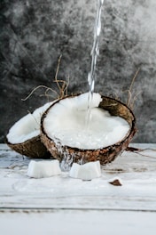 brown and white cake with white candle