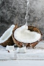 white round cake with white cream on brown wooden round tray