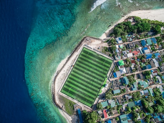 aerial view of city buildings near body of water during daytime in Kurendhoo Maldives