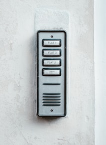 gray metal door with white wall