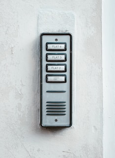 gray metal door with white wall
