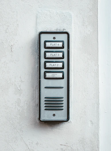 gray metal door with white wall
