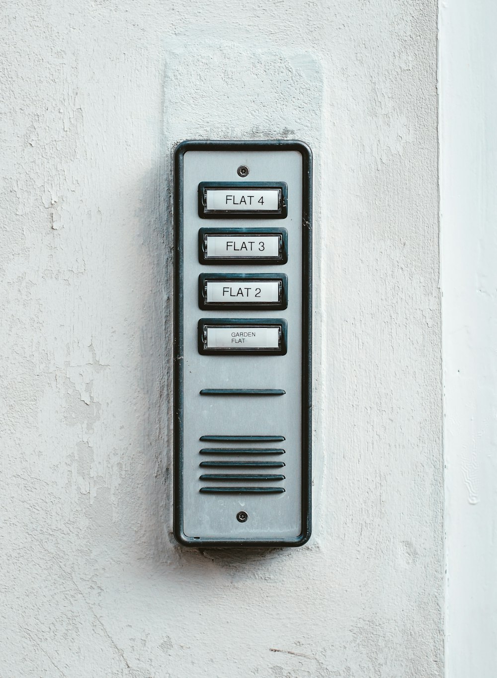 gray metal door with white wall