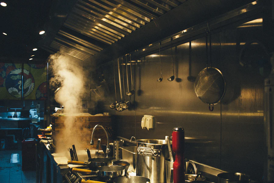 Stainless steel cooking pots on a commercial stove