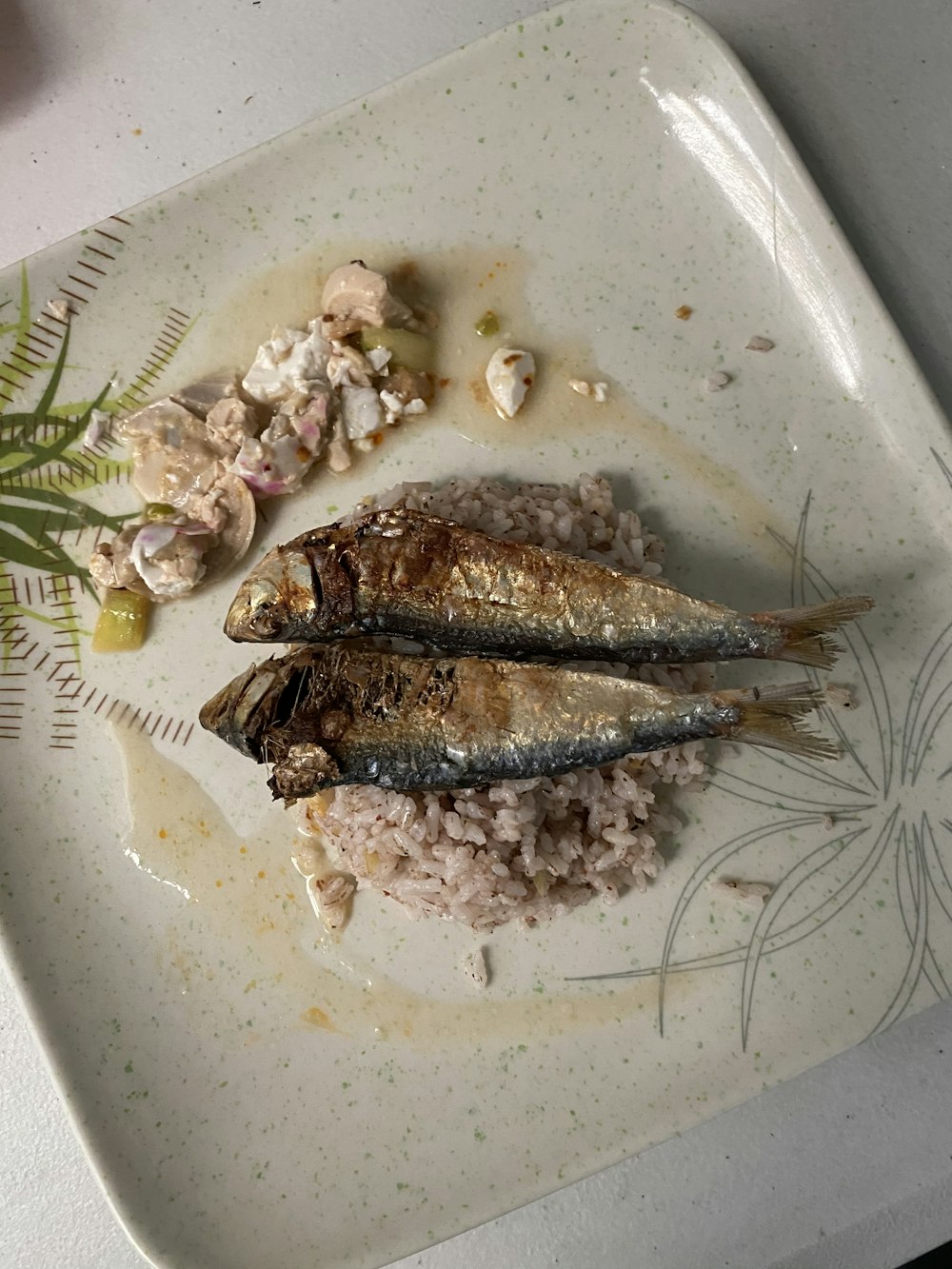 grilled fish on white ceramic plate