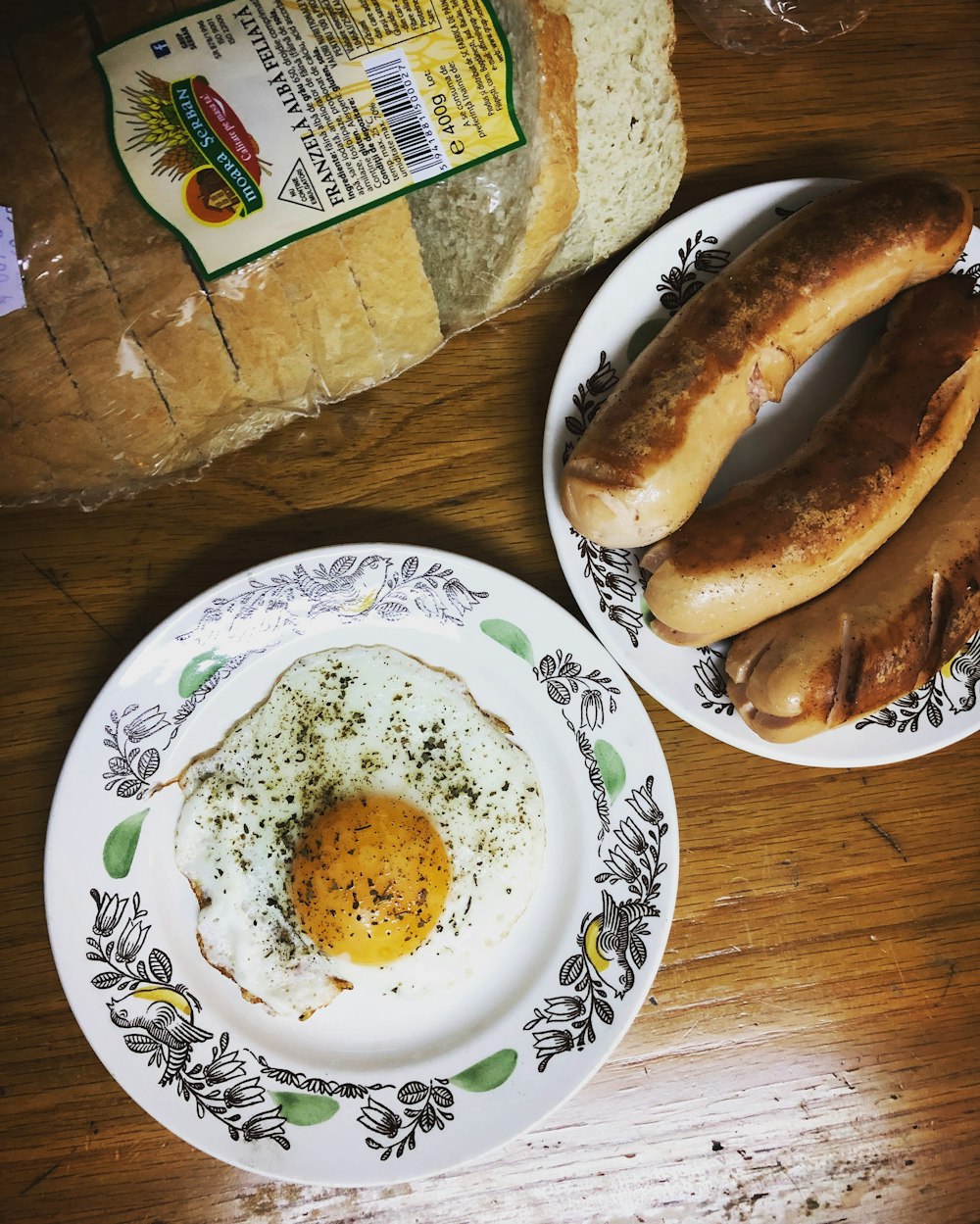 bread on white green and blue floral plate