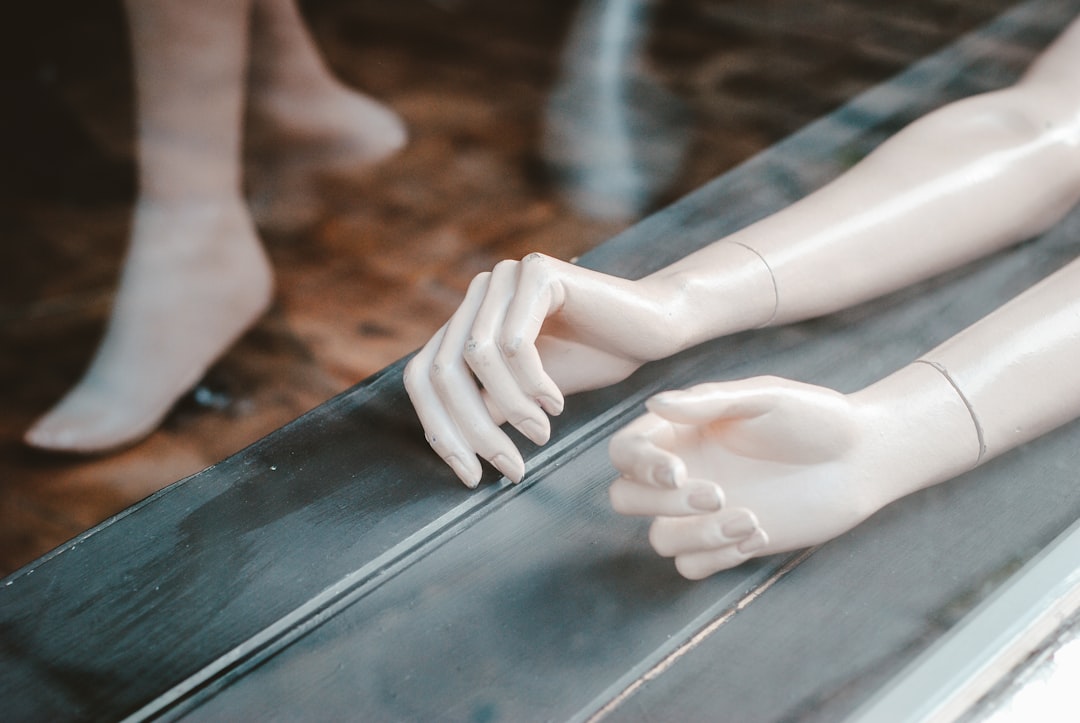mannequin arms lying on a window sill