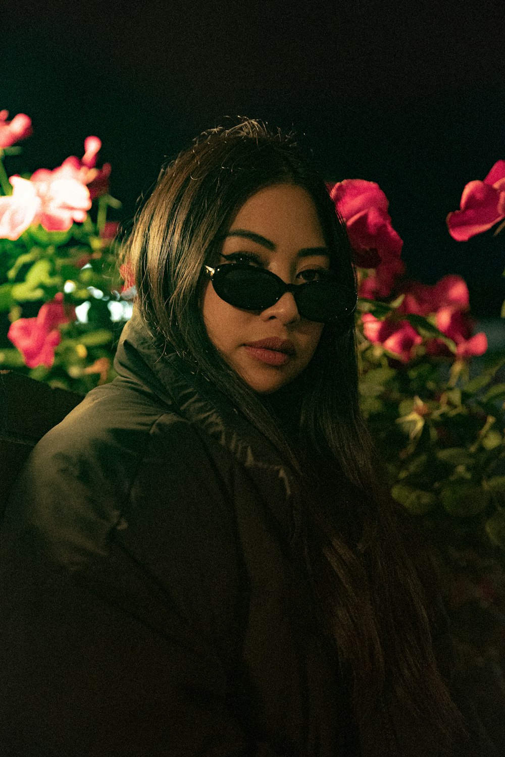 woman in black sunglasses and brown hoodie