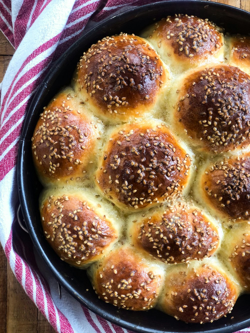 brown and white pastry on black round plate