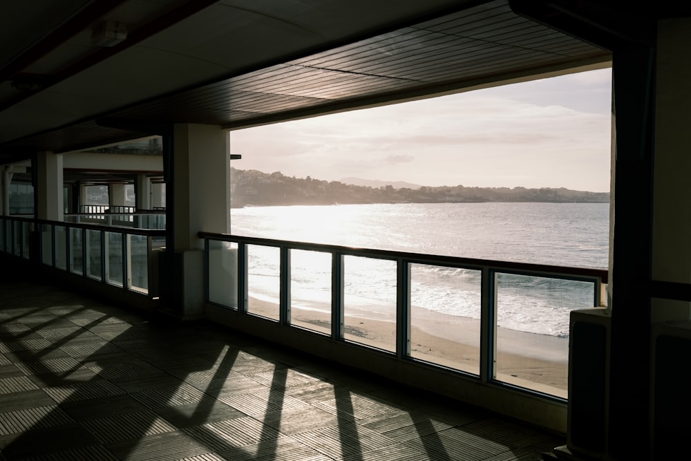 white wooden railings near sea during daytime