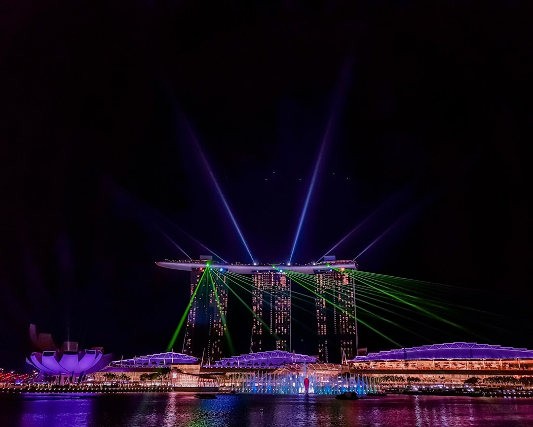 green bridge with lights during night time