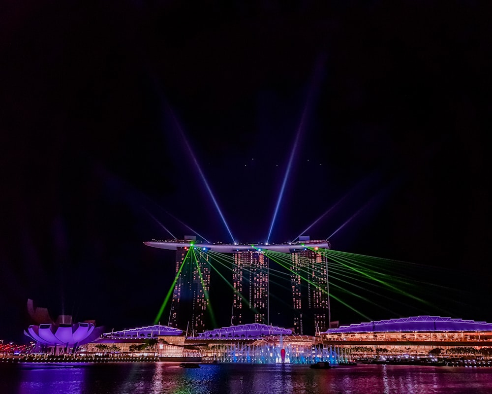 green bridge with lights during night time