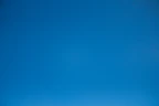 A clear and cloudless bright blue sky