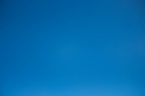 A clear and cloudless bright blue sky