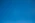 A clear and cloudless bright blue sky
