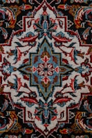 red white and black floral textile