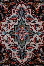 red white and black floral textile