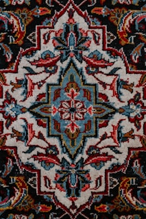 red white and black floral textile