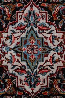 red white and black floral textile
