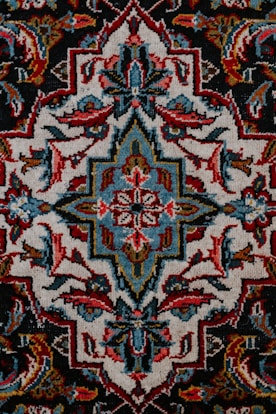 red white and black floral textile