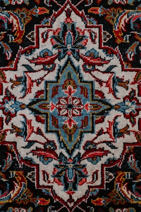 red white and black floral textile