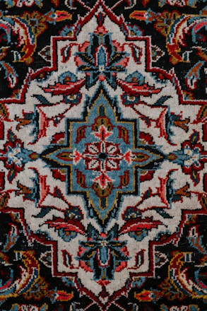 red white and black floral textile