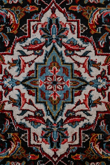 red white and black floral textile